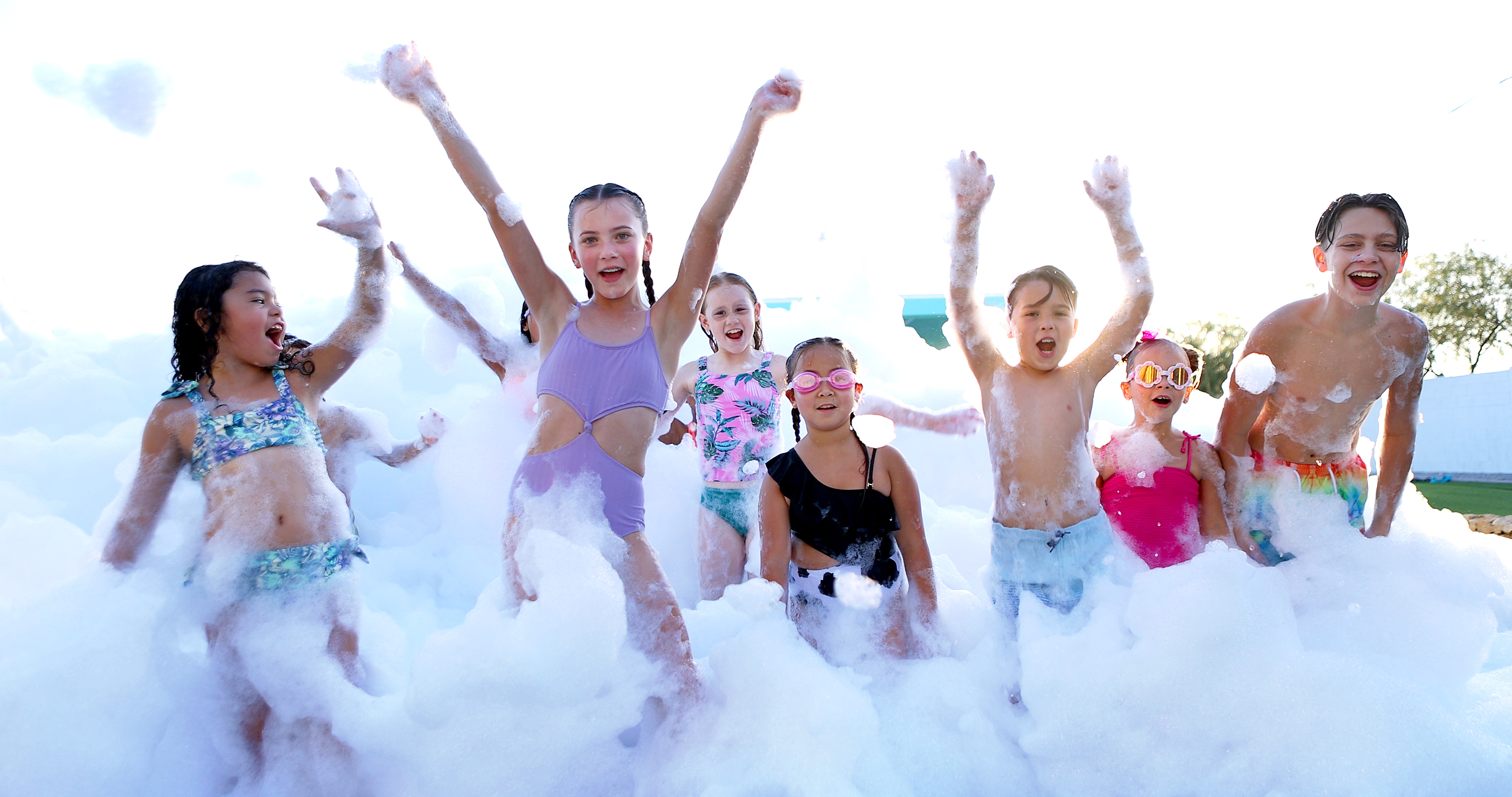 Kids playing in foam at a birthday party